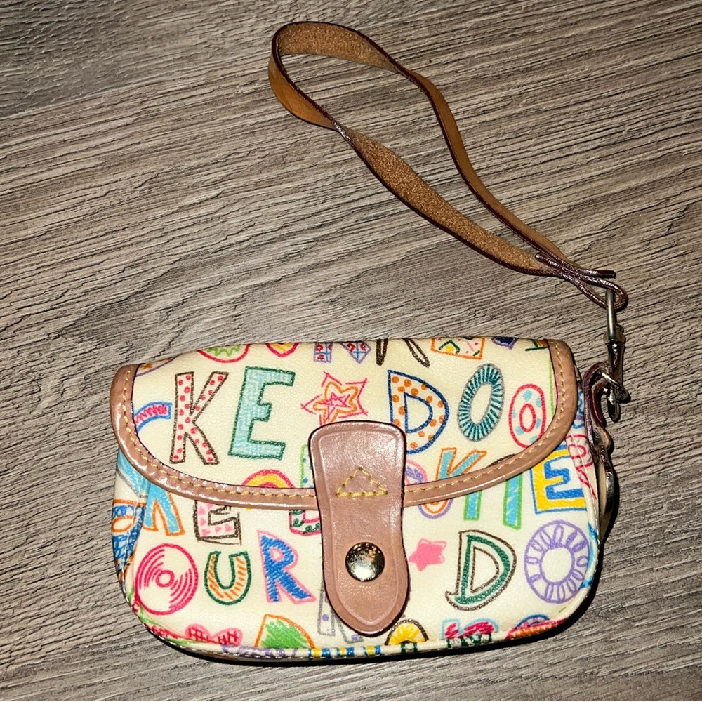 Dooney & Bourke multicolor wristlet. Good condition. Leather strap.